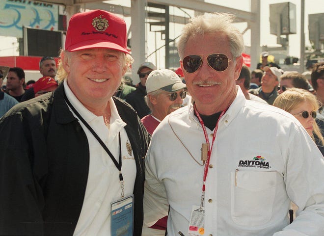 Donald Trump, left, poses with Robert Blackwell along pit road prior to the 2001 Daytona 500 at Daytona International Speedway on Feb. 18, 2001. [Fred Stoll/News-Journal]