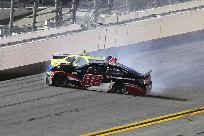 Daniel Suarez (96) and Ryan Blaney wreck as they come out of turn 4 during the first of two NASCAR Daytona 500 qualifying auto races at Daytona International Speedway, Thursday, Feb. 13, 2020, in Daytona Beach, Fla. (AP Photo/David Graham)
