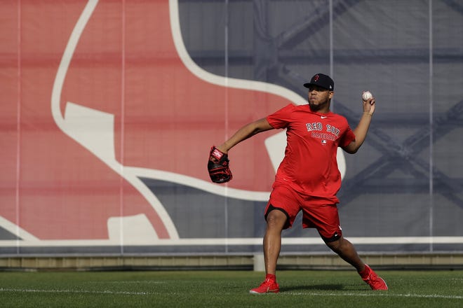 Boston Red Sox relief pitcher Darwinzon Hernandez throws after reporting for spring training baseball Tuesday in Fort Myers, Fla. (AP File Photo/John Bazemore)