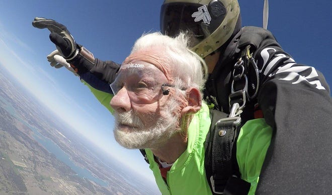 Sun City resident Ernie Columbus, 100, skydives near Salado on Friday. [LUIS HERMOSILLO/Skydive Temple]