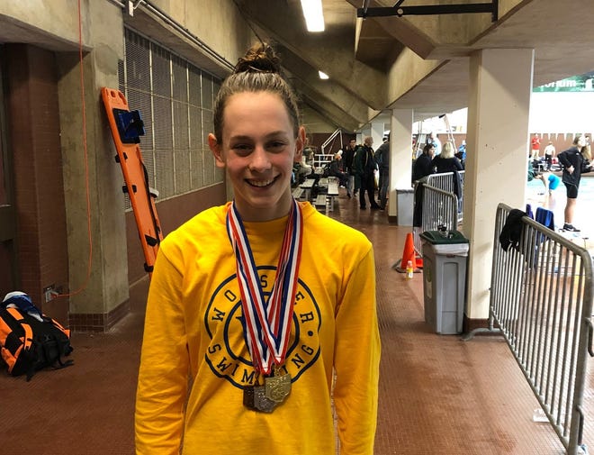 Wooster's Gracie Chelf rocking her district medals after another hugely successful day.