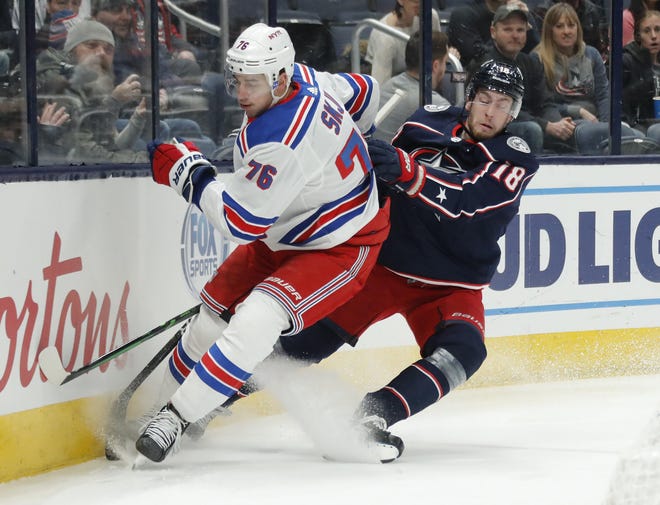 Center Pierre-Luc Dubois, right, has been moved to another line by coach John Tortorella in an effort to add a spark to the Blue Jackets’ sputtering offense. [Adam Cairns/Dispatch]