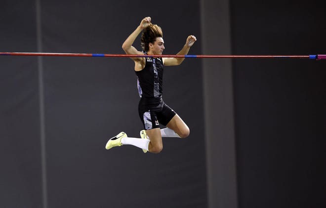 Sweden’s Armand Duplantis breaks the world record height in the Pole Vault during the Muller Indoor Grand Prix at Emirates Arena on Saturday in Glasgow. [Ian Rutherford/PA Wire]