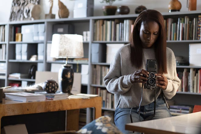 In the romance film "The Photograph," Issa Rae plays a museum curator who finds herself grappling with the recent loss of her elusive and estranged mother. [Contributed by Sabrina Lantos/Universal Pictures]