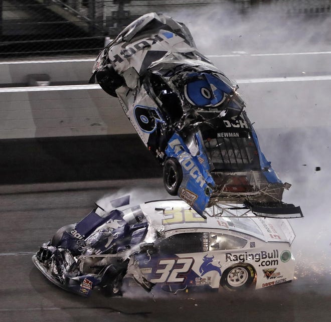 Ryan Newman’s car goes airborne after being hit by Corey LaJoie as they approach the finish line in the Daytona 500. Newman, who was leading when initially hit by Ryan Blaney, was placed in an ambulance and taken to a hospital. [Chris O'Meara/The Associated Press]