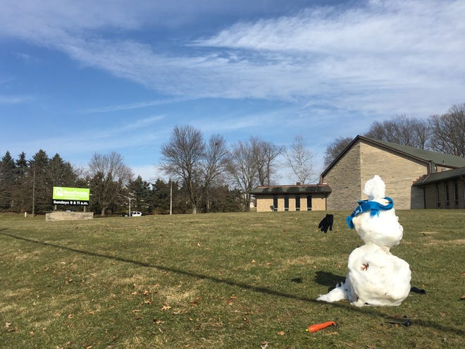 Despite most of last week's snow melting, a snowman still stands outside NewPointe Community Church along Oak Hill Road in Wooster on Monday, Feb. 17, 2020.