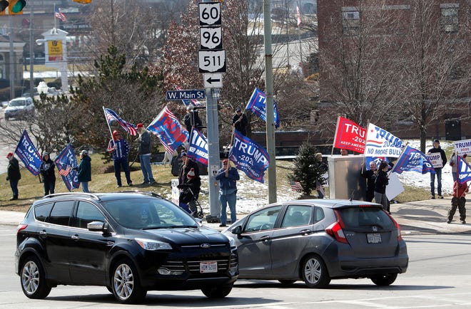 In observance of Presidents Day on Monday, several people gather at Corner Park at West Main Street and Claremont Avenue in downtown Ashland in support of President Donald J. Trump.