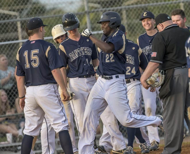 Eustis' Nehemiah Cook (22) scores after hitter a two-run homer in the sixth inning against South Lake in the David Lee Memorial tournament at David Lee Diamond-Stuart Cottrell Field in Eustis. [PAUL RYAN / CORRESPONDENT]