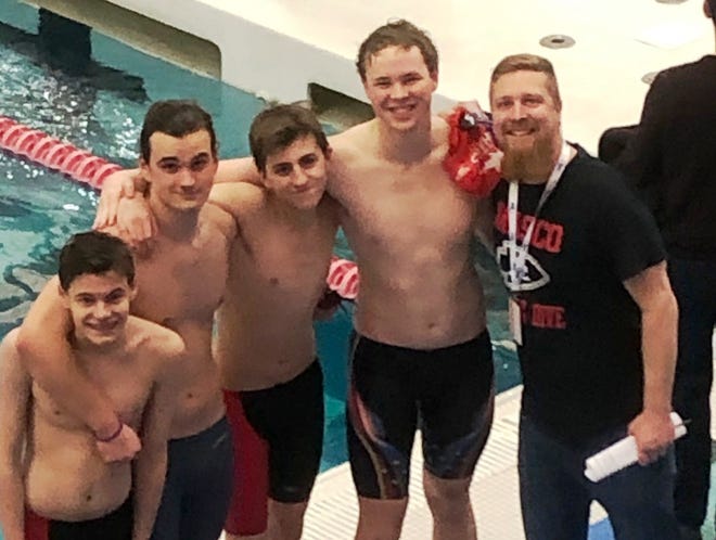 The Masconomet Division 1 State Meet boys swimmers are shown with their coach Ben Hanchett. They are, from left, Daniel Voner, John Petersen, Colin Panagos, Anthony Piacentini and Hanchett. [Courtesy photo]