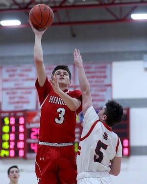 Hingham's Luke Mashburn goes up for a shot while defended by Silver Lake's Sean Waters. [Wicked Local Staff Photo/ Robin Chan]