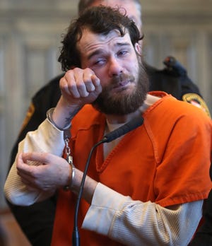 Daniel Shmigal wipes away his tears after pleading guilty to murder and aggravated vehicular assault for the hit-and-run crash in Summit County Common Pleas Judge Mary Margaret Rowlands' court on Wednesday Feb. 19, 2020. Shmigal struck Charles Holden and Derek Smith on March 17, 2019 in the area of Virginia and Barbara avenues in Akron and drove away. Holden, 33, died, while Smith, 29, survived. [Mike Cardew/Beacon Journal]