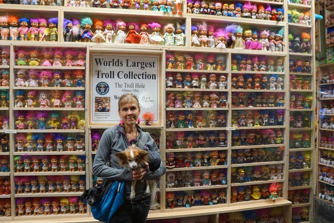 Founder Sherry Groom in one of the 14 rooms of Alliance, Ohio's Troll Hole, which houses more than 8,000 trolls.