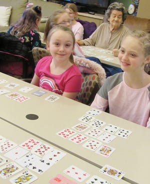 Valley Residential Services residents enjoyed a game of Pokeno with fifth-grade students from Herkimer Elementary School on Feb. 13. Activities staff organized the game as a fun, intergenerational activity that drew in a multitude of seniors for recreation, laughs and engagement with the students and their advisers. With an expansion project of 14 one-bedroom apartments large enough for couples, a fully staffed wellness and fitness center, restaurant-style dining and a variety of activities and events, Valley Residential Services offers a myriad of opportunities for seniors. There will be an opportunity for the public to tour the apartments and meet with staff at an open house event from 1 to 3 p.m. Monday, Feb. 24. For more information or to register for the open house, contact Christine Shepardson, director of community life, at 315-219-5700, ext. 3239. From left, Herkimer Elementary School fifth-grade students Melinda Poplawski and Alanna McArthur play Pokeno at Valley Residential Services. [SUBMITTED PHOTO]