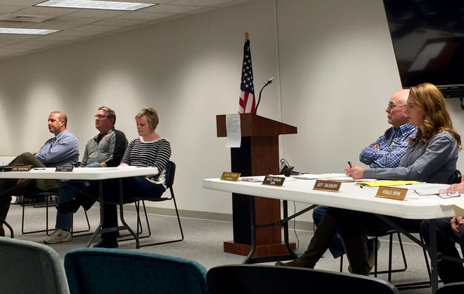 Tuesday, Feb. 18, the Zeeland Township Board of Trustees listens to resident concerns about an ordinance that would restrict development to make way for an expansion of M-231. [Carolyn Muyskens/Sentinel Staff]