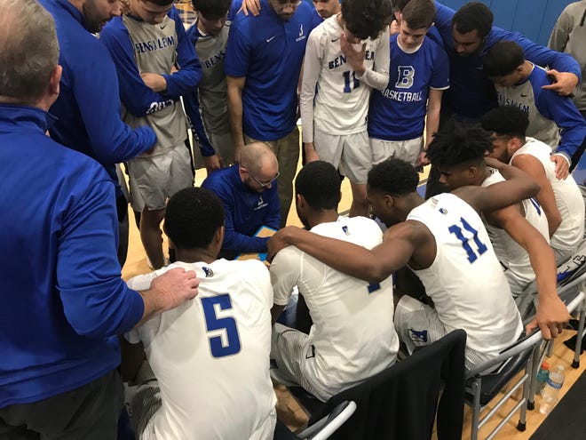 Bensalem coach Ron Morris instructs his team during a fourth-quarter timeout in Friday’s 51-43 win over Downingtown East. [TODD THORPE/STAFF PHOTOJOURNALIST]