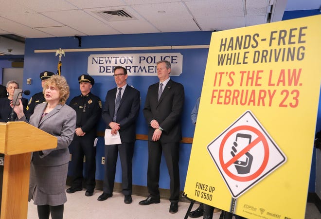 Transportation Secretary Stephanie Pollack held up her cell phone during a press conference Thursday about implementation of the new safe driving law. [Photo: Sam Doran/SHNS]