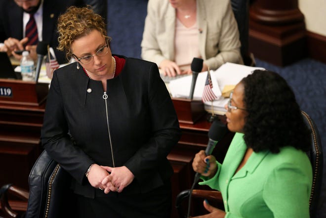 Rep. Erin Grall listens as her co-sponsor, Rep. Kimberly Daniels, speaks during debate over HB 265, which would require parental consent for abortion, at the Capitol on Thursday. [TORI LYNN SCHNEIDER / THE TALLAHASSEE DEMOCRAT]