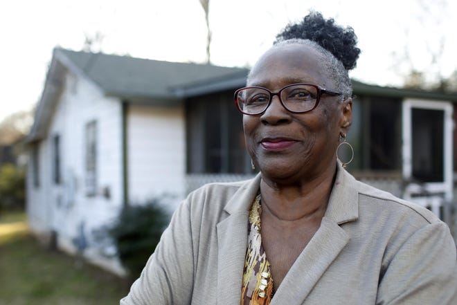 Former Linnentown resident Geneva Johnson Eberhart poses for a photo in front of her home, one of the last Linnentown houses left in Athens, on Jan 29, 2020. Eberhart’s father moved the home across town after the family was forced to move. [Photo/Joshua L. Jones, Athens Banner-Herald]