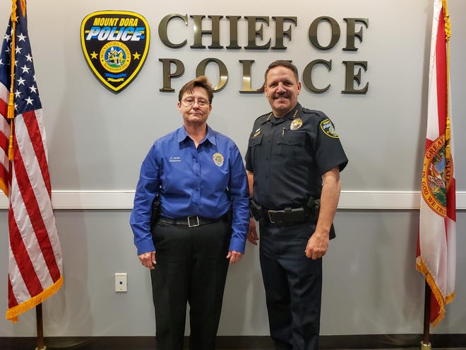 Detective Angie Smith, Mount Dora Police Department’s Officer of the Year, stands with Mount Dora Police Chief Robert Bell on Thursday. [Payne Ray/Daily Commercial]