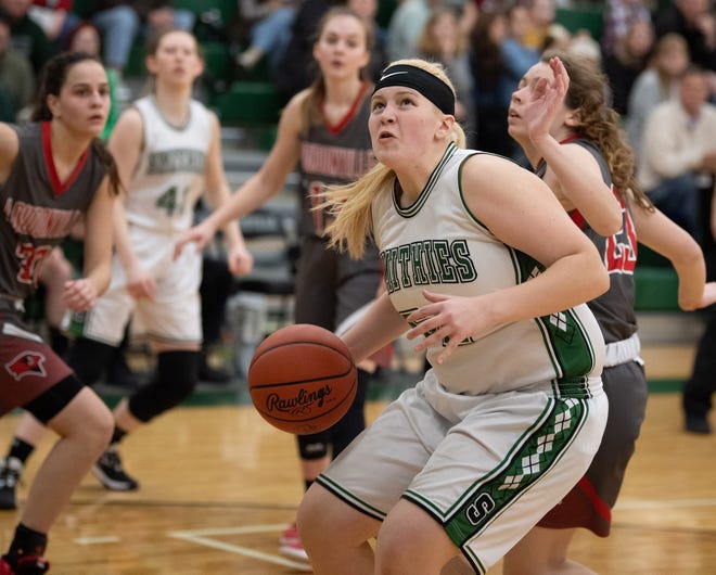 Smithville's Isabelle Besancon spins to the basket for a score during a high school girls basketball sectional final game against Loudonville Saturday night at Smithville High School. The Smithies won, 61-50.
