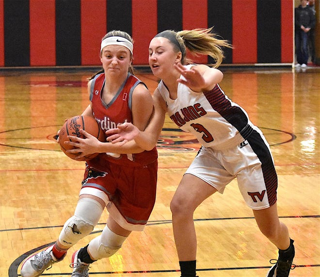 Sandy Valley's Tori Sickafoose drives against Tusky Valley's Abbey Dillon. (The News Leader / Todd Reed)