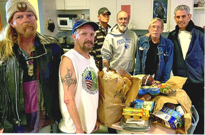 Marvin Miller, far right, president of the Jewish Federation of Volusia & Flagler Counties, delivers food from the federation’s Jerry Doliner Food Bank to a homeless shelter for veterans in Daytona Beach. (Photo provided)