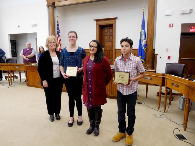Yates County Legislator Leslie Church, chair of the Human Services Committee congratulates Kayla Andersen (second from left) and Eli Raplee (right), who received Distinguished Youth Awards Feb. 11, as presented by Yates County Youth Bureau Director Alicia Avellaneda (third from left).