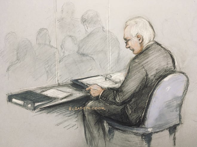 This is a court artist sketch of Wikileaks founder Julian Assange in the dock reading his papers as he appears at Belmarsh Magistrates' Court for his extradition hearing, in London on Monday. The U.S. government and WikiLeaks founder Julian Assange will face off Monday in a high-security London courthouse, a decade after WikiLeaks infuriated American officials by publishing a trove of classified military documents. [Elizabeth Cook/PA via AP]