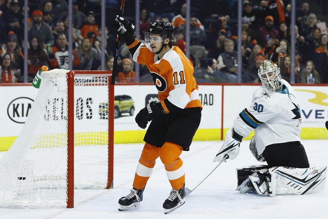 The Flyers' Travis Konecny celebrates after scoring a goal on the Sharks' Aaron Dell during Tuesday night’s game. [MATT SLOCUM / ASSOCIATED PRESS]