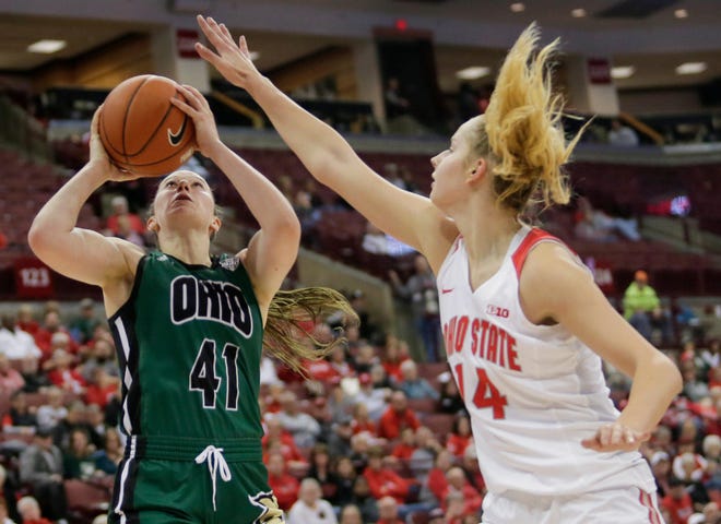 Ohio State Buckeyes sophomore Dorka Juh‡sz (14) blocks a shot by Ohio Bobcats junior Gabby Burris (41) during the game between the Ohio State Buckeyes and the Ohio Bobcats at Value City Arena in Columbus, Ohio on Sunday, Nov. 17, 2019. [Maddie Schroeder/Dispatch]