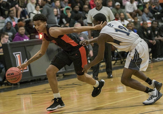 Leesburg's Akiem Nickerson (10) drives to the basket against Eustis on Dec. 5 at the Hive in Leesburg. The Yellow Jackets play at Sebring on Tuesday in a Class 5A-Region 2 semifinal game. [PAUL RYAN / CORRESPONDENT]