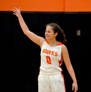 Fennville's Coryne Howard acknowledges the crowd after setting the all-time scoring record at Fennville on Tuesday. [Dan D'Addona/Sentinel Staff]