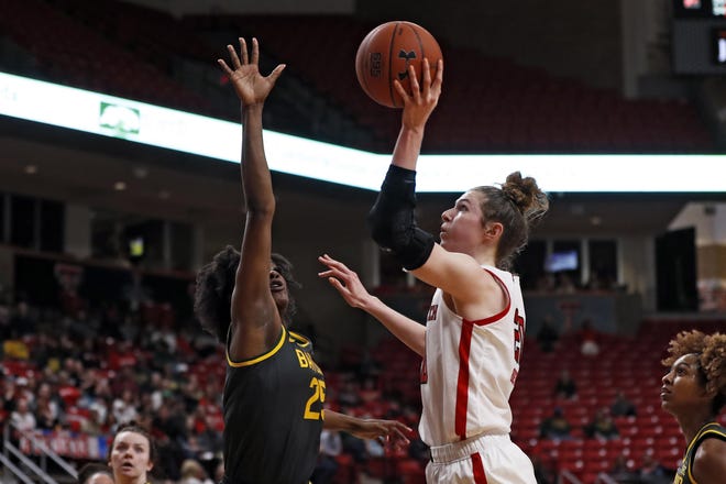 Texas Tech's Brittany Brewer (20) shoots the ball over Baylor's Queen Egbo (25) during the second half of a Big 12 Conference game Feb. 18 at United Supermarkets Arena. [AP Photo/Brad Tollefson]