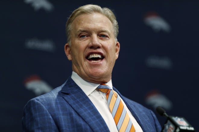 Denver Broncos general manager John Elway introduces the team's new head coach, Vic Fangio, during a news conference at the team's headquarters Thursday, Jan. 10, 2019, in Englewood, Colo. (AP Photo/David Zalubowski)