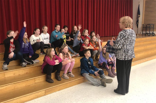 Herkimer Elementary School students listen to a representative of the Veterans Administration Medical Center in Syracuse on Tuesday. The school raised $836.32 to donate to the VA through a “penny war” at the school. [SUBMITTED PHOTO]