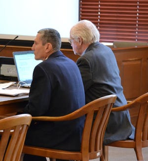 Suspended Middletown Lt. Richard Gamache listens to testimony in court Tuesday. On Wednesday a jury found Gamache guilty of 13 counts. [LAURA DAMON/DAILY NEWS PHOTO]