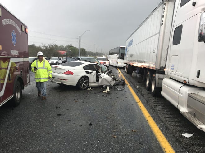 Four people were taken to local hospitals following a four-vehicle wreck Wednesday afternoon on Interstate 75 southbound at State Road 40 in Ocala. [Austin L. Miller/Ocala Star-Banner]