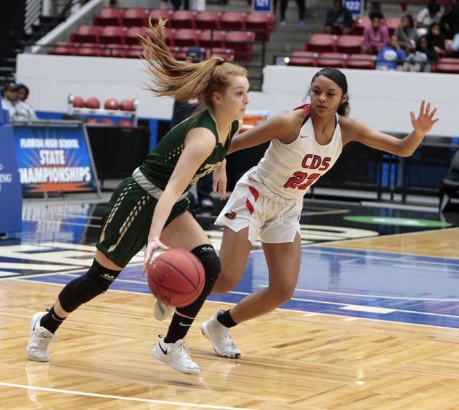 Madeline Boehm of Saint Stephen's brings the ball up the court onTarriyonna Gary during the first half of Wednesday Class 3A state semifinal at the RP Funding Center in Lakeland. [HERALD-TRIBUNE STAFF PHOTO / DENNIS MAFFEZZOLI]