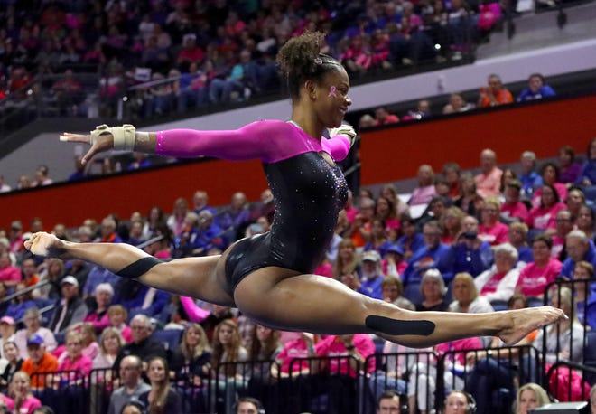 Florida gymnast Trinity Thomas performs during her floor routine Friday against Alabama at Exactech Arena. The Gators defeated Alabama to win the regular season SEC championship. [Brad McClenny/Staff photographer]
