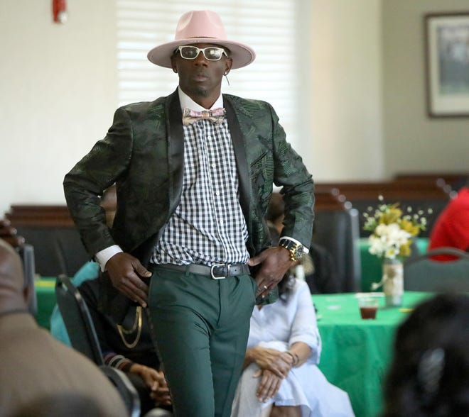 Bruce McFayden shows off some men's fashion from Harrell's Mens Wear during the Dreamer's Foundation Inc., 6th annual Chef's Smorgasbord, Fashion Show and Silent Auction held at Ironwood Golf Course on Saturday. [Photos by Brad McClenny/For The Guardian]