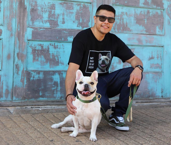 Round Rock veteran and business owner George Hernandez with his dog and "son," Zeus. [COURTESY PHOTO]
