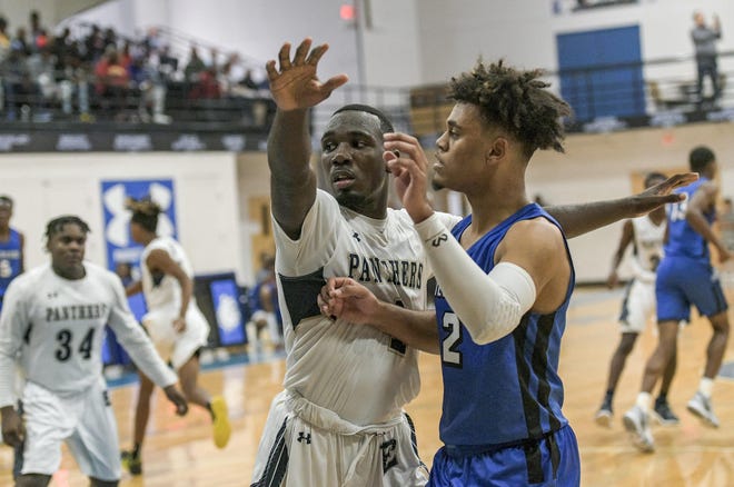 Two of the top players in Lake and Sumter counties over the past few seasons — Eustis’ Bradley Douglas (left) and Wildwood’s Marcus Niblack (2) — battle during a preseason tournament in November at Mount Dora Christian Academy in Mount Dora. Both players averaged more than 20 points per game as seniors. [PAUL RYAN / CORRESPONDENT]