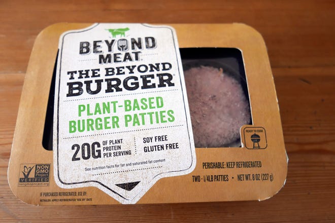 A package of Beyond Meat meatless burgers is seen in Orlando, Fla. (AP Photo/John Raoux, File)