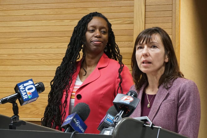 Ewa King, right, associate director of the state Department of Health, speaks Thursday about the tests available for the coronavirus. At left is director Dr. Nicole Alexander-Scott. [The Providence Journal / Sandor Bodo]
