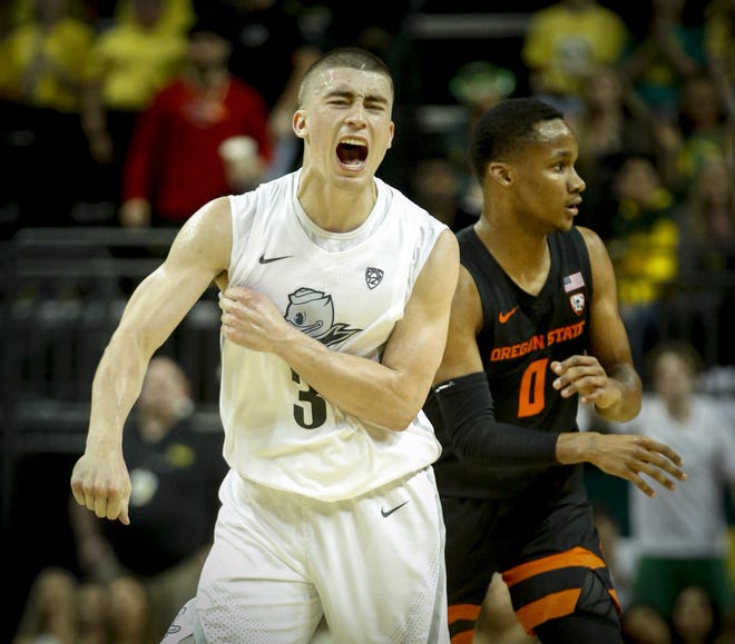 Oregon's Payton Pritchard reacts after making 3-point shot over Oregon State's Gianni Hunt as the shot clock expired to give the Ducks a 45-28 lead over the Beavers in the second half. [Andy Nelson/The Register-Guard] - registerguard.com