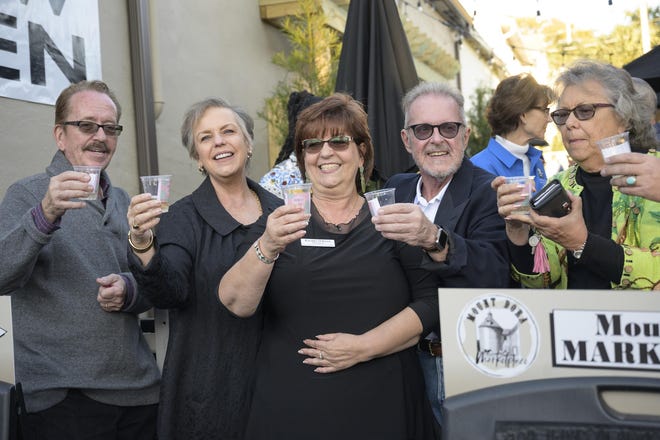 Chamber members join the owners of the Mount Dora Marketplace for a toast at the grand opening on Thursday. [Cindy Sharp/Correspondent]