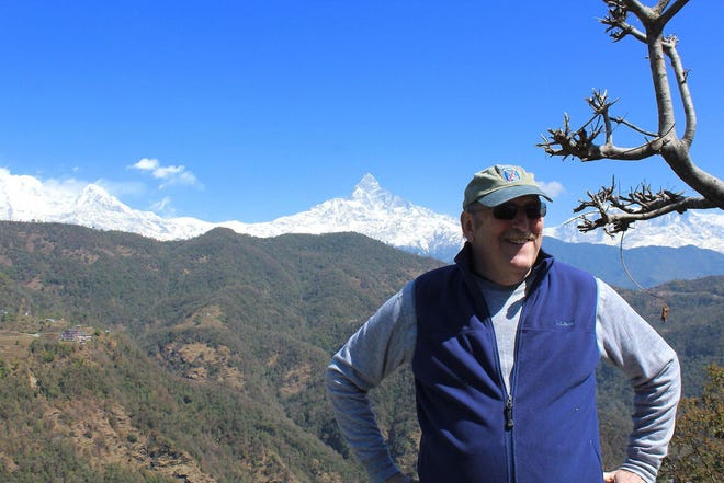 Hamilton College Professor Maurice Isserman stands in front of the Himalayan Mountains in 2018. [SUBMITTED PHOTO]
