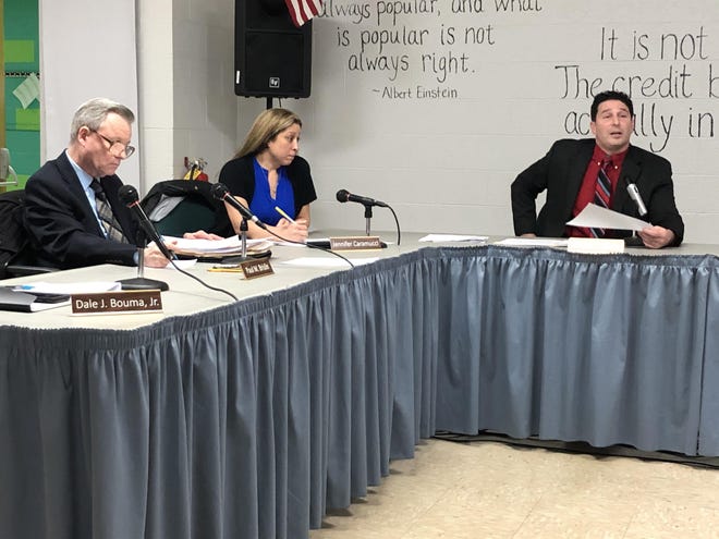 Montague Superintendent Timothy Capone, pictured at Monday’s school board meeting, responded to those demanding his ouster, many of whom he suggested have ulterior motives. Pictured, at left, are board members Paul Brislin and Jennifer Caramucci. [Photo by Eric Obernauer/New Jersey Herald (NJH)]