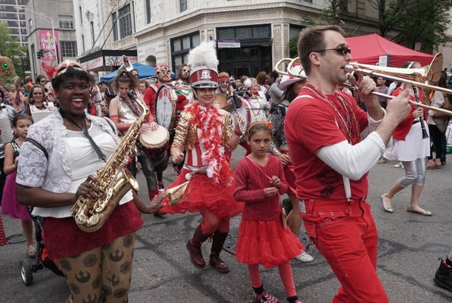 The Extraordinary Rendition Band and other performers march in the PVDFest parade down Washington Street in Providence in 2017. [The Providence Journal, file / Sandor Bodo] Original