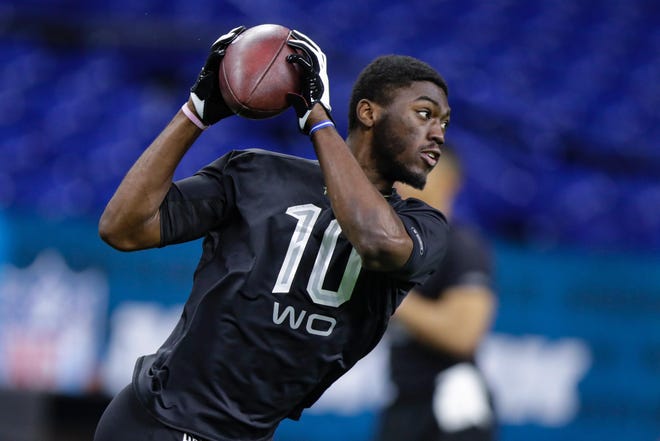 Rhode Island wide receiver Isaiah Coulter runs a drill at the NFL Combine in Indianapolis on Thursday. He and his cousin, fellow Ram Aaron Parker, are hoping to get drafted. [AP / Michael Conroy]